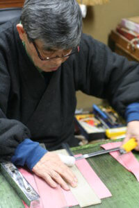 Takenaka making hina dolls