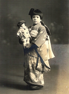 One of the dolls from the U.S. held by a Japanese girl
