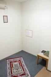 A prayer room with Mecca directional arrow
