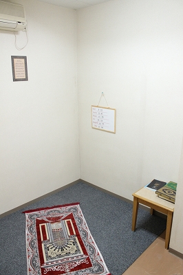 A prayer room with Mecca directional arrow