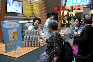Suntory Booth providing customers with samples